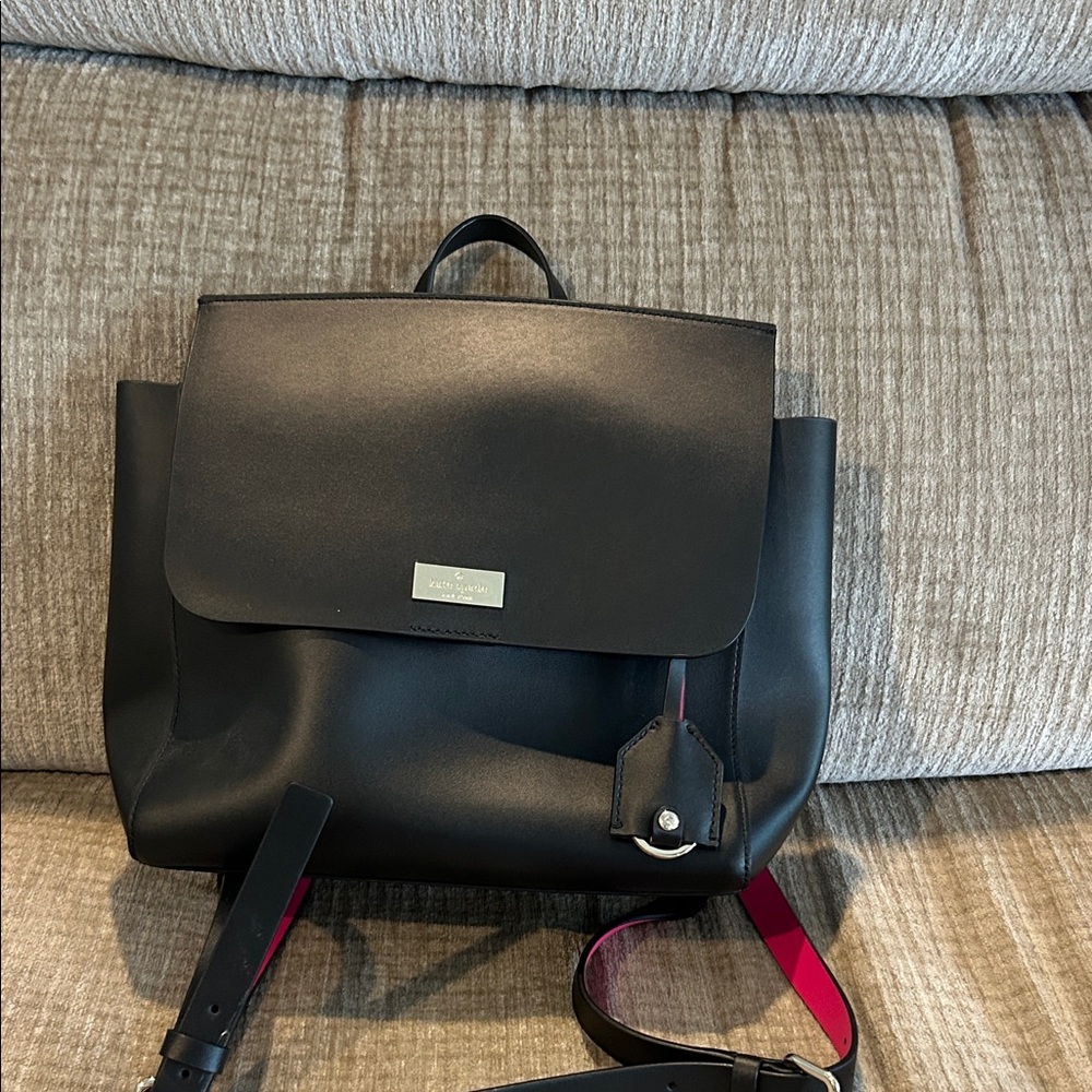 Kate Spade box like black leather backpack with hot pink interior with pocket